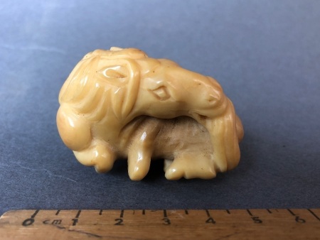 Vintage Japanese Ivory Nestuke in the Shape of a Recumbant Horse Chewing it's Tail - Unsigned