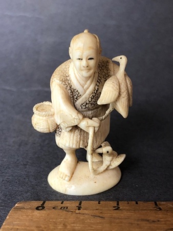 Antique Japanese Carved Ivory Netsue in the Form of a Fisherman with his 2 Fishing Birds. Character Signature to Base - Intricately Carved