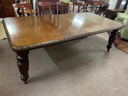 Large Antique Mahogany Extendable Dining Table on Original Casters with Acanthus Carved Legs and Edge