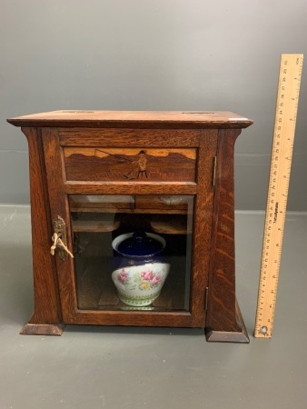 Antique Arts and Crafts Oak Smoking Cabinet with Marquetry Fisherman Panel and Original Ceramic Tobacco Jar and Dishes