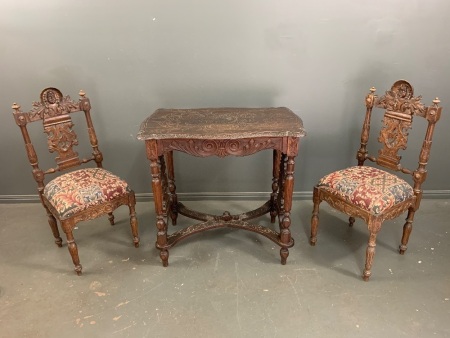 Elaborately Carved 19th Century French Table and 2 Matching Upholstered Chairs