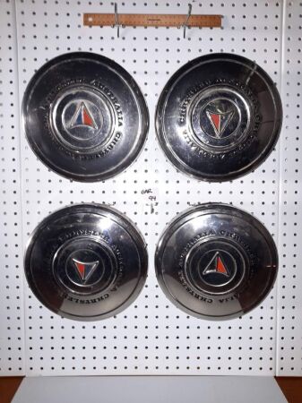 SET OF 4 VINTAGE CHRYSTLER AUSTRALIA HUBCAPS - CONDITION GOOD