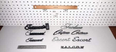 VINTAGE FORD BADGES - 3 X FAIRMONT, 2 X FALCON, 2 X ESCORT, 2 X CORTINA, 1 X FAIRLANE. 132 ON TAG - CONDITION GOOD