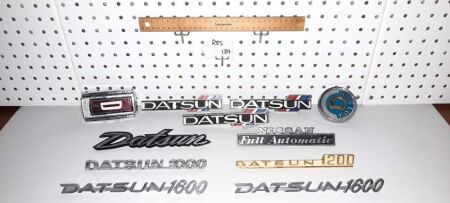 VINTAGE DATSUN CAR / TRUCK BADGES. - CONDITION GOOD