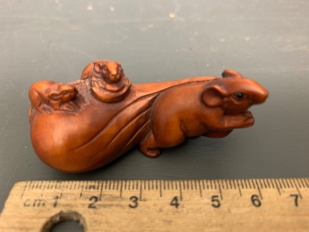 Carved and Signed Boxwood Netsuke Depicting a Rat with a Sack