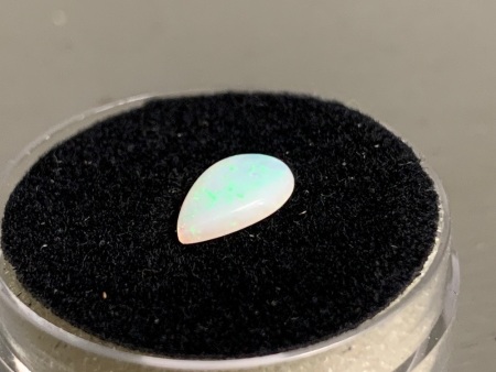 0.55 ct Solid Teardrop Coober Pedy Opal 9 mm x 6 mm. Mainly Green flashes