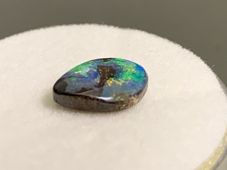 1.4 ct Freeform Trapezoid Solid Black Lightning Ridge Opal 8.8 mm x 6.4 mm. Brilliant Green flashes