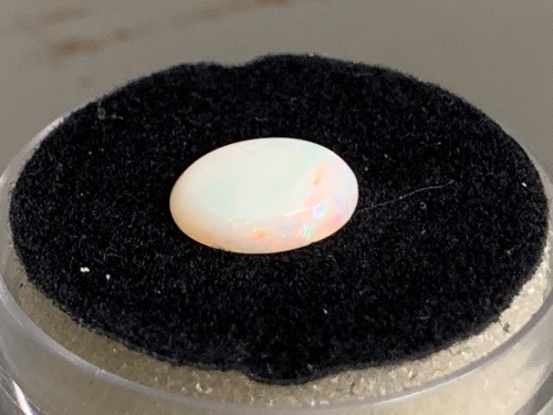 1.1 ct Coober Pedy 9 mm x 7mm Oval Solid Opal. Rolling red flash.