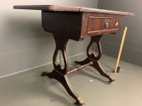 Side table with 2 small drop sides, tan inset leather top with gold embossed borders, single drawer, lyre-shaped supports on stretcher base, on castors - 2