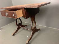 Side table with 2 small drop sides, tan inset leather top with gold embossed borders, single drawer, lyre-shaped supports on stretcher base, on castors - 3