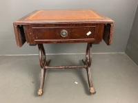 Side table with 2 small drop sides, tan inset leather top with gold embossed borders, single drawer, lyre-shaped supports on stretcher base, on castors - 4