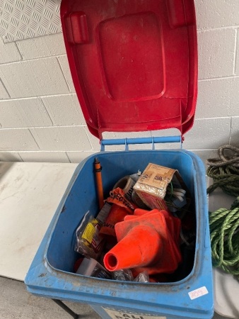 Blue wheelie bin full of assorted equipment 