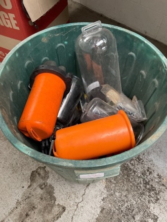 Bin with contents including orange and clear plastic covers