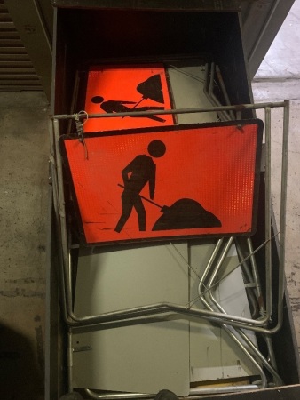 Large box of assorted traffic signs and communication bends