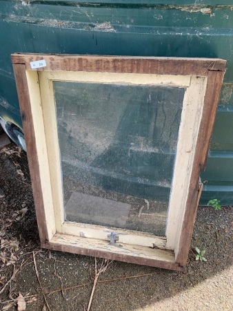 Wooden hopper window in casement