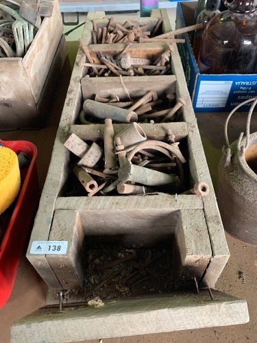 Wooden storage box containing old hardware