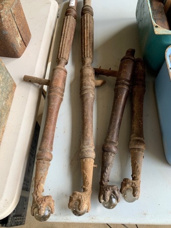 Interesting chair legs with man's head motif metal feet and glass insert