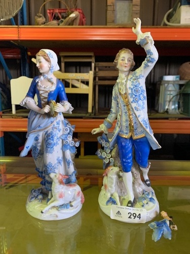 Man and woman figurines with pieces for repair