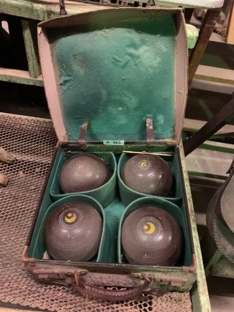 Vintage lawn bowls in case