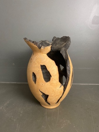 Large wooden vase with burned/hollowed look
