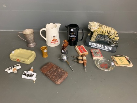 Bengal Gin tiger figurine, Beefeater Gin jug, Beneagles Eagle, Jim Beam shot glass, various stoppers, 2 x set of old playing cards, mixed coasters, J&B scotch whisky ash tray, Clan Campbell Jug, leather hip flask holder, Orlando ashtray