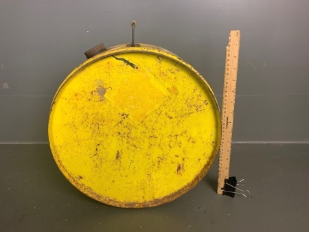 Vintage yellow round metal fuel can with feet