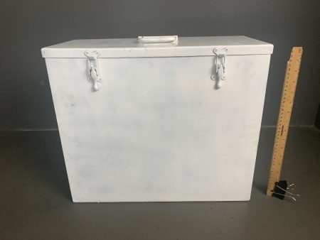 Freshly painted white metal storage box