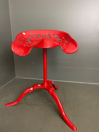 Freshly painted red metal swivel stool