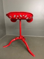 Freshly painted red metal swivel stool - 2