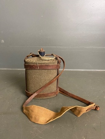 Antique army water canister with hand stitched cover with leather and canvas strap