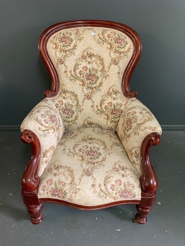 A floral material & timber chair