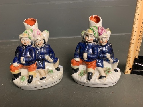 Pair of Staffordshire pottery spill vases of men in uniform