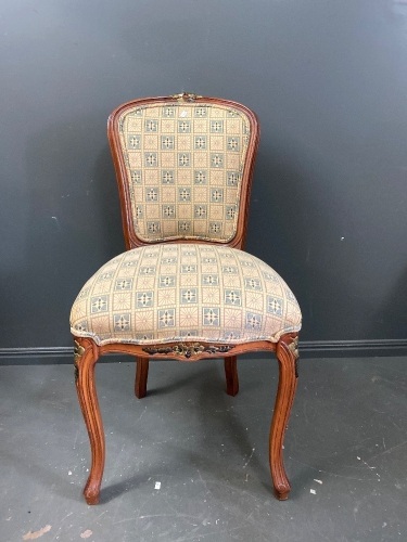 Antique chair with carved rose motif