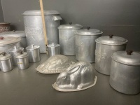 Large collection of Aluminium ware. 2* cake tins, 1 bread tin with lid, 3* caniters / label (1 lid), 4* canisters /no labels 4 lids, 2* jelly moulds, 1* coulinder,* spice jars with lids, 5* spice jars with lids - 2