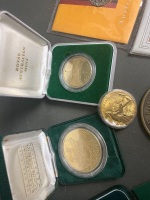 Qty commemorate coins in boxes ,including 2 x Australian 1st proof $1 coins, Don Bradman $5, 3 x royal mint coins, lady Diana marriage coin, 3 x 50cent and 1st day Melbourne cup stamp - 2