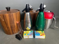 2* large wooden ice buckets (one missing handle), 1* Anodized Ice Tongs, 2* Anodized Soda Syphons (plus bulbs), 1* Ice crusher