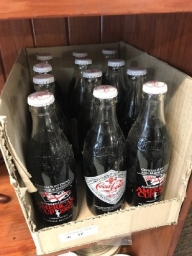 Collection of 12 Vintage Bottles of Coca Cola Celebrating 1987 Americas Cup Win