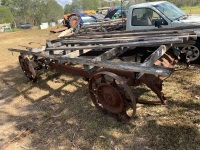 Large garden cart believe to be made from Chevrolet chassis with handmade wheels