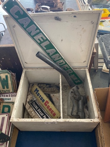 Metal storage cupboard with some name plates 