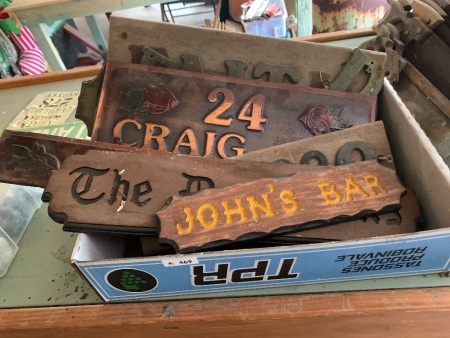 Box of wooden and copper signs