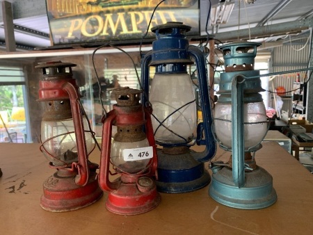 4 kerosene lanterns