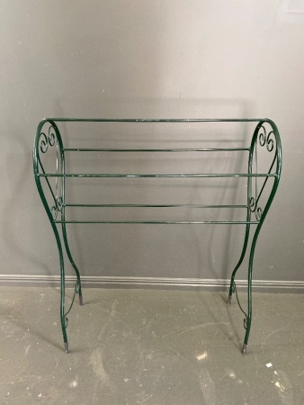 Green metal towel rack