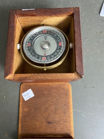 Asian ship compass in wooden box