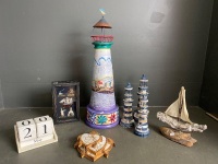 Jim Shore Light house decoration with 3 smaller lighthouses, turtle coasters, calendar and nautical inspired diorama and sailing ship