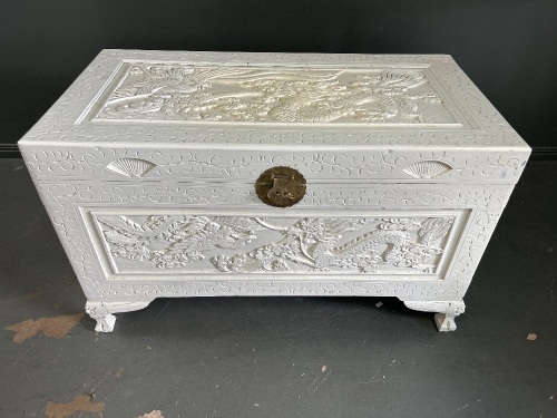 Large carved white camphor chest with brass catch and hinges