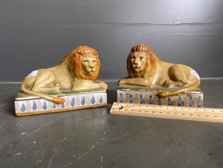 Pair of Staffordshire pottery lions