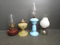 Four kerosene lanterns bakelite and ceramic