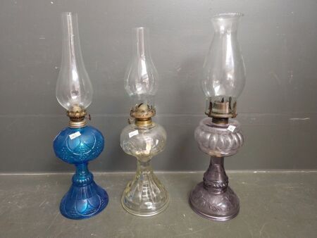 3 kerosene lanterns- blue, lilac and clear glass