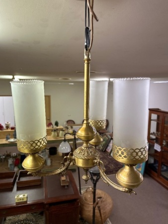 Brass hanging light fitting and smoked glass shades