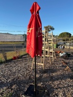 Large red patio umbrella in metal stand - 2